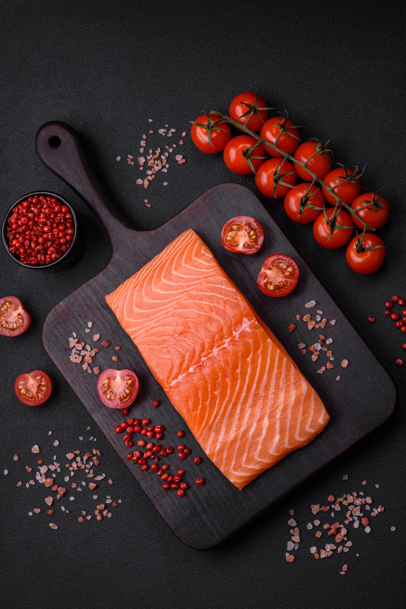 Fresh raw salmon red fish fillet with salt and spices